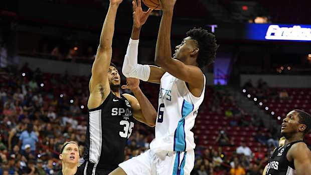 Charlotte Hornets forward Jalen McDaniels (6) shoots against San Antonio Spurs forward Jordan Barnett (35) during the second half of an NBA Summer League game at Thomas & Mack Center. (Stephen R. Sylvanie-USA TODAY Sports)